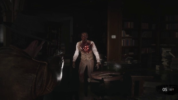 The Sinking City 2 review screenshot of a zombie in dark sunken library
